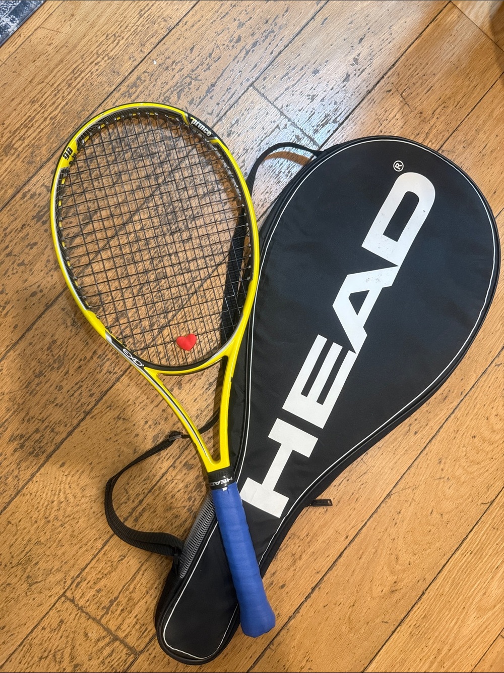 Head Yellow Tennis Racket with Blue Grip and Black Cover